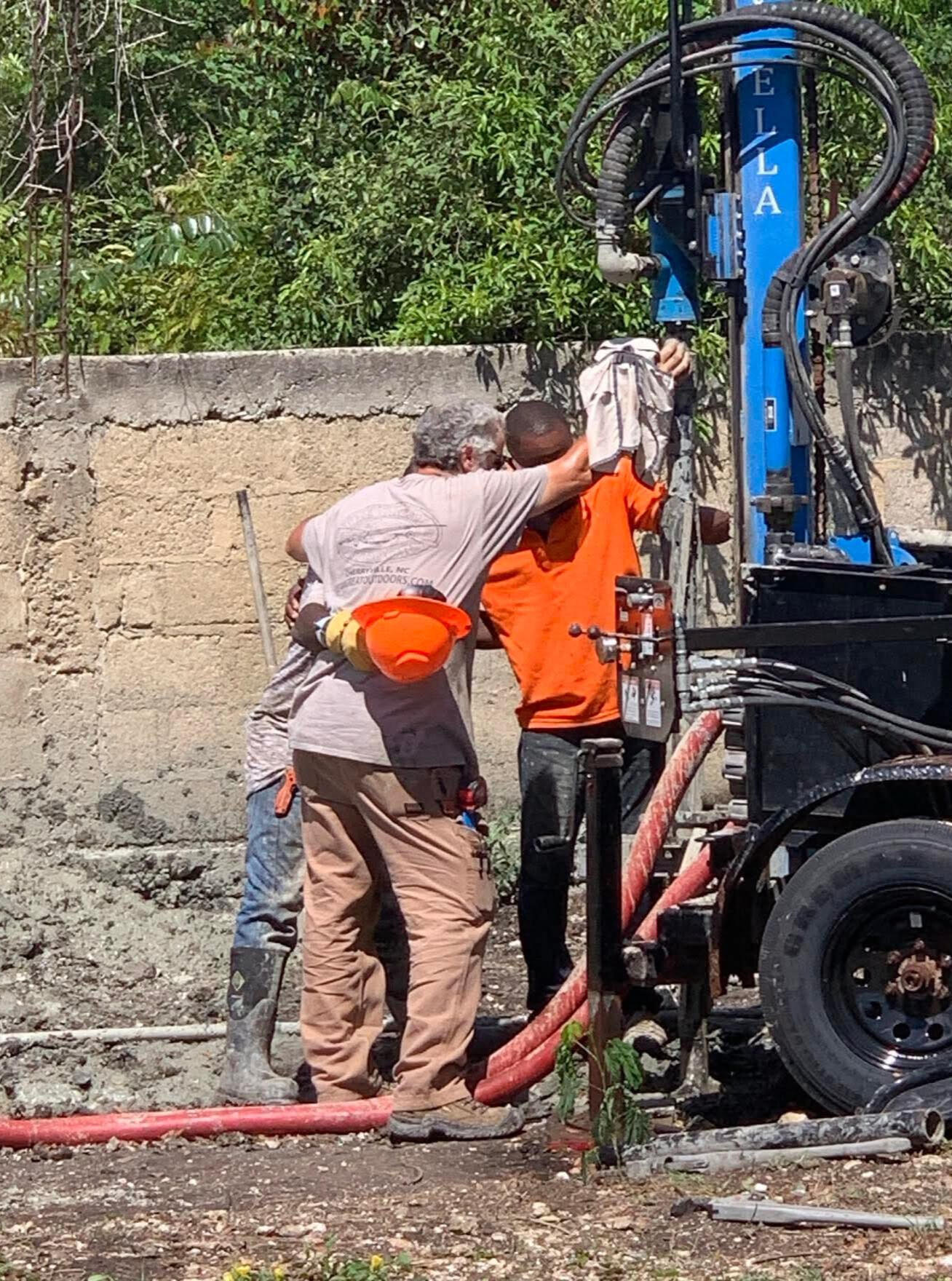 Nicky Runk in Haiti Praying / Drilling